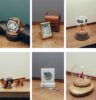 Die Gewinnerobjekte des Cartier-Wettbewerbs 2024: Marta Maziers (La Reine du Temps), Yann Mayer (Inverso), Coline Riondet (Présentoir à parfum), Hugo Mandrillon (Œil du Temps), Samuel Pauly (Nefertum) und Simon Girard (Ballet floral)