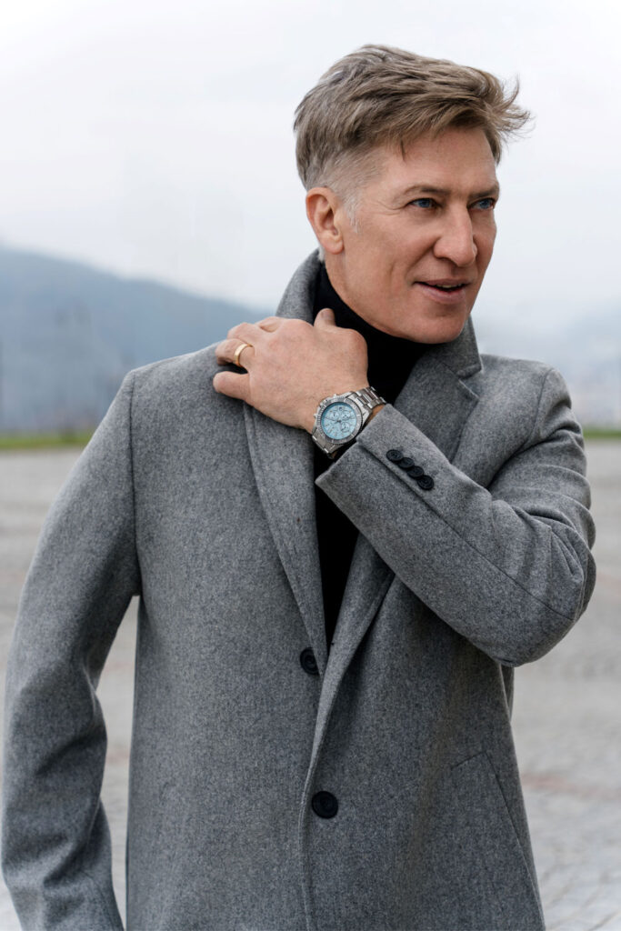 Tobias Moretti wears a watch by Jacques Lemans