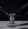 Close-up of part of the movement; watchmakers are assembling the movement of the Ulysse Nardin Super Freak