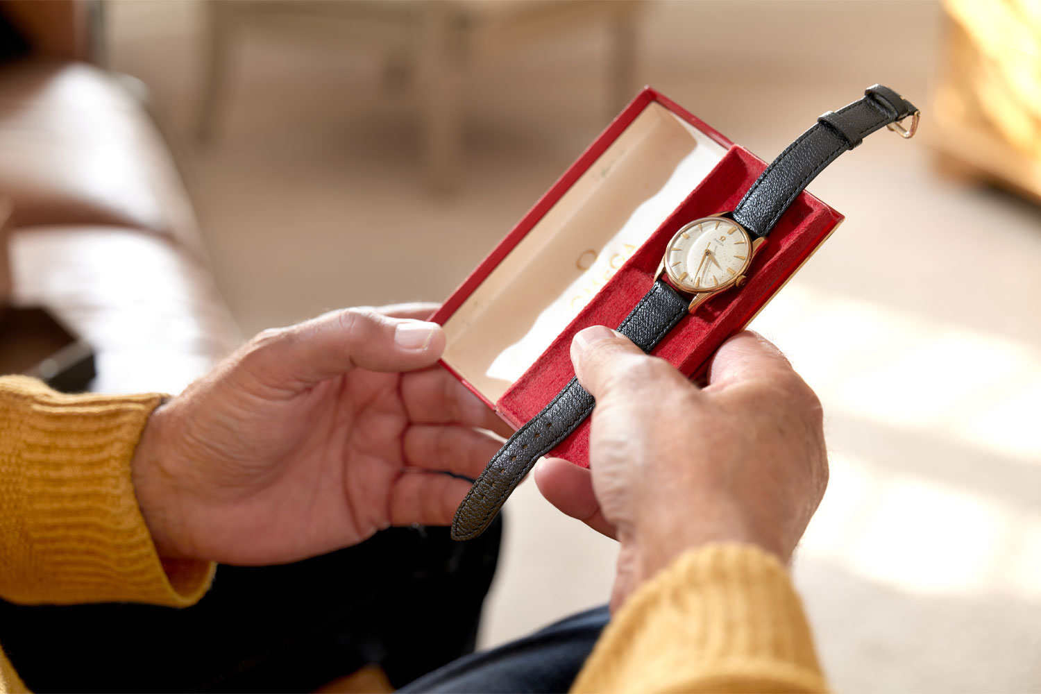 A watch is taken out of a box